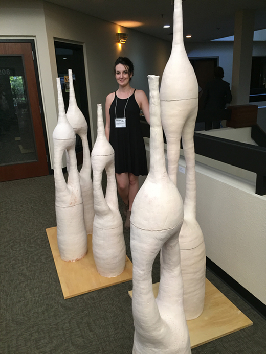 Chloe Rahimzadeh pictured with her work at the California Conference for the Advancement of Ceramic Art
